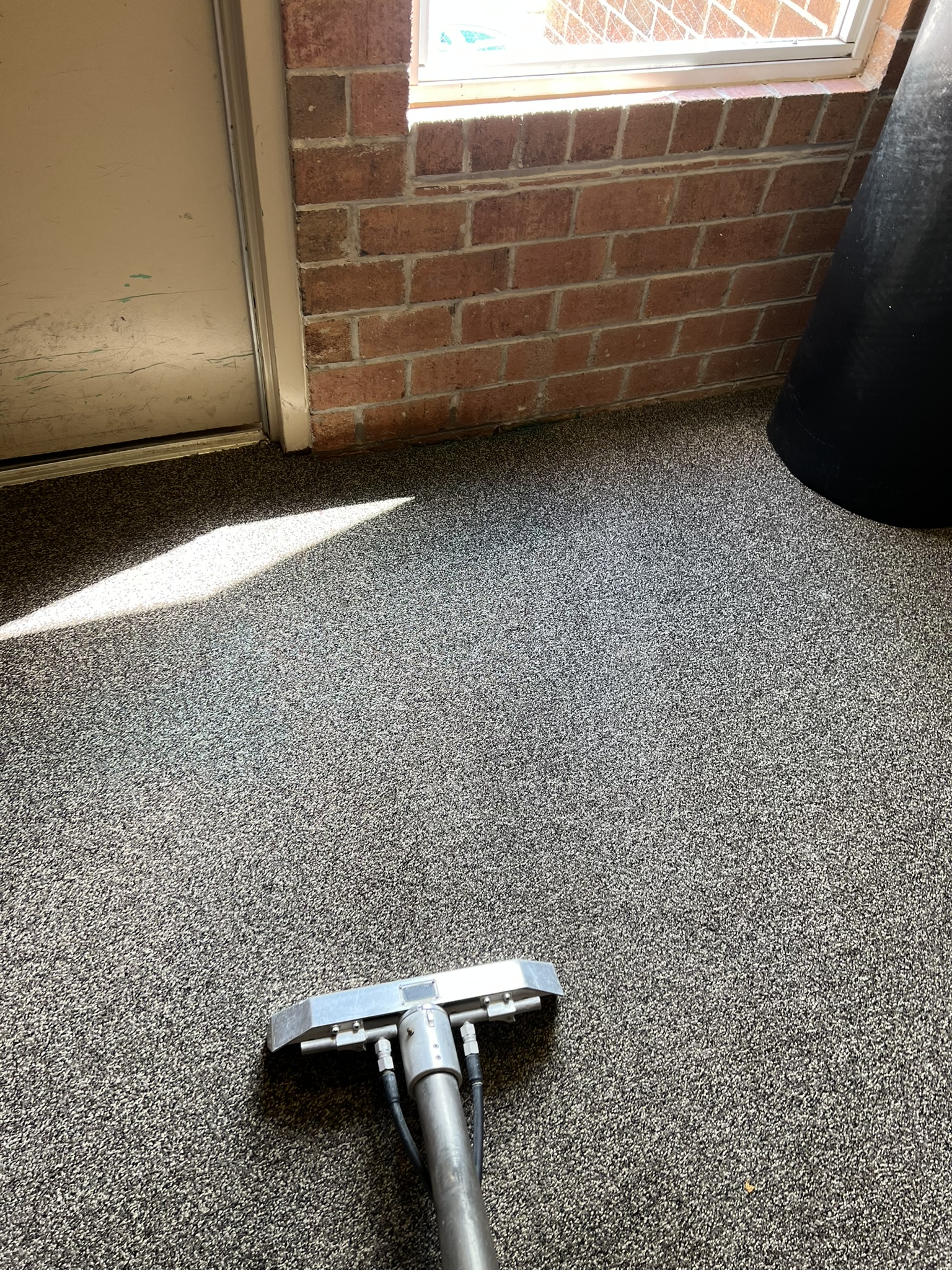 Same multi-unit entryway after cleaning, fully clean with cleaning wand visible