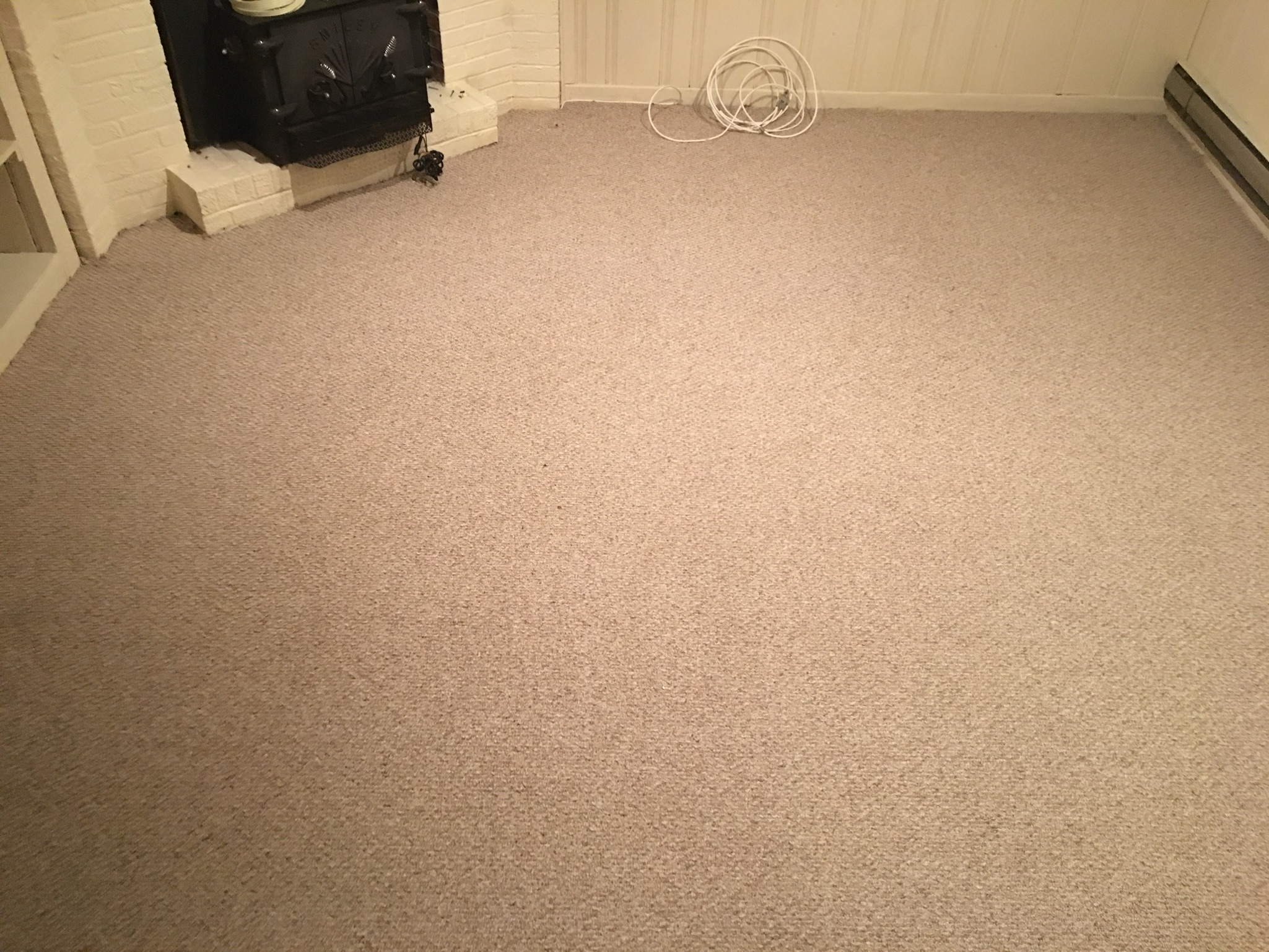 Residential fireplace room after carpet cleaning